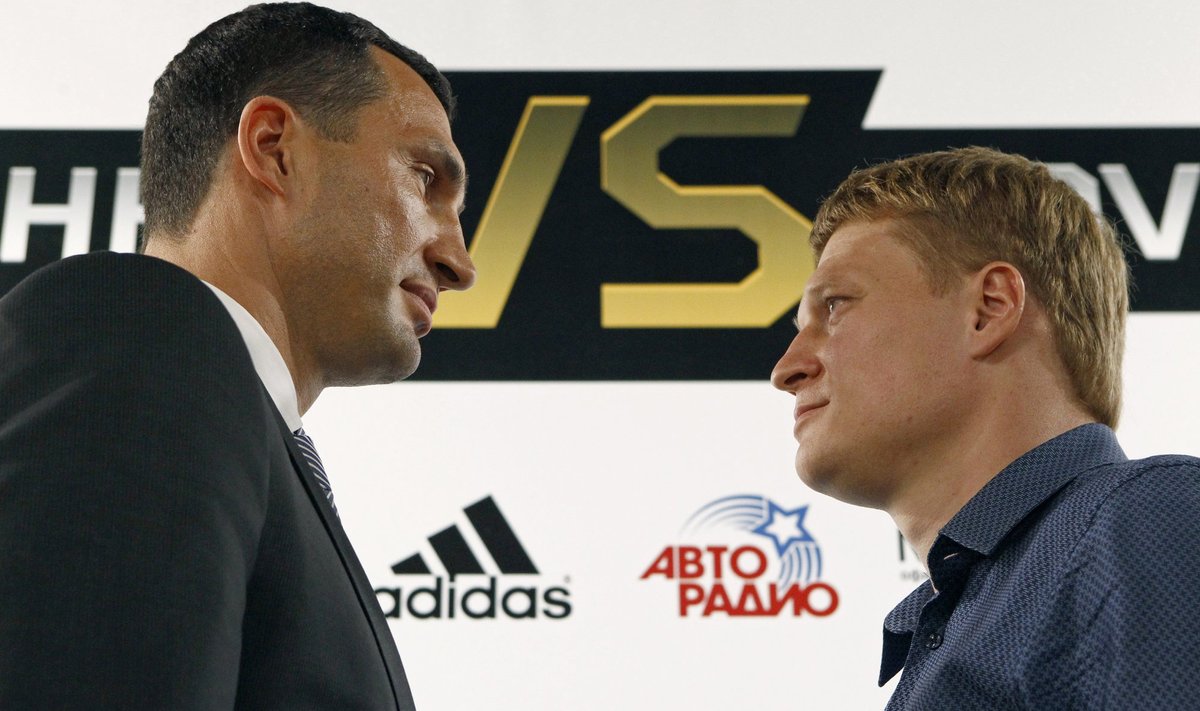 Ukrainian heavyweight boxing world champion Klitschko and his challenger Povetkin of Russia pose after their news conference in Moscow