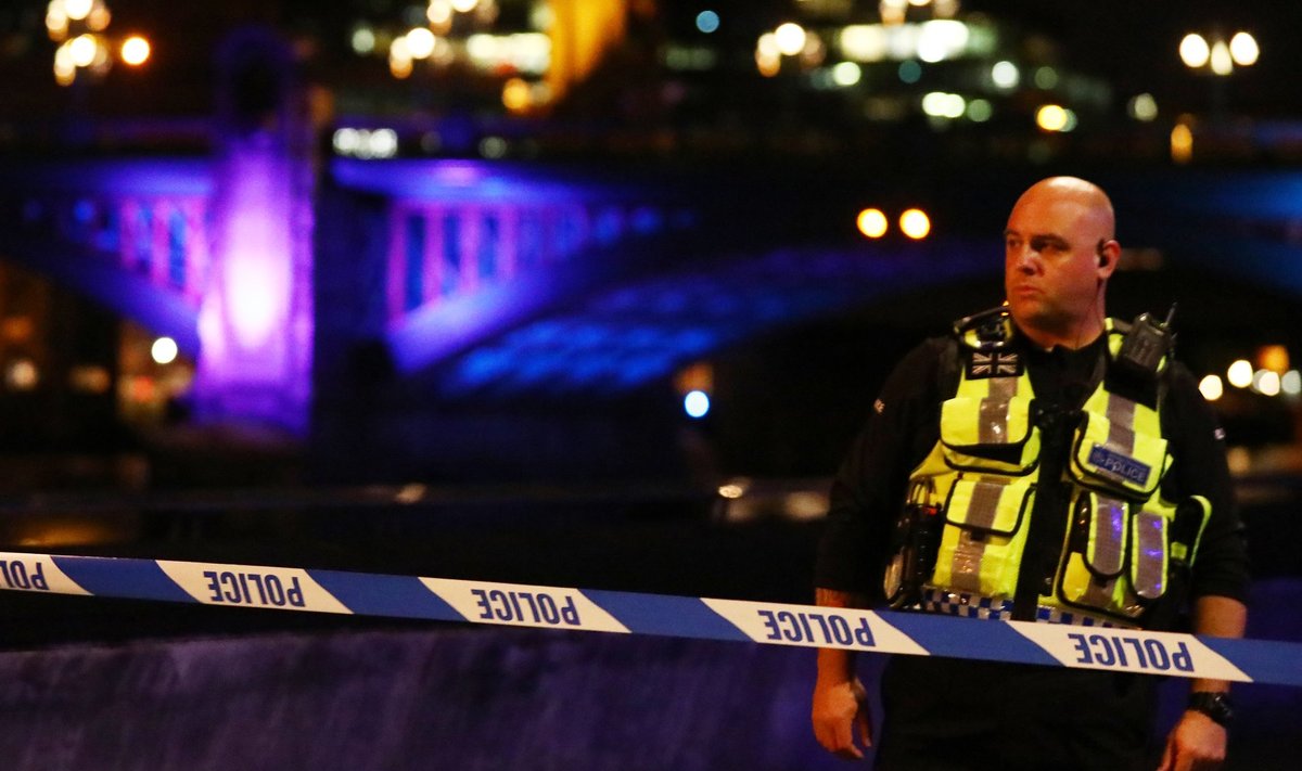 A police officer guards a cordon after an incident near London Bridge in London