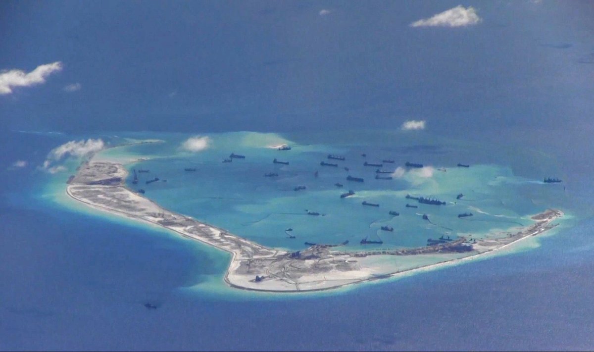 File still image from United States Navy video purportedly shows Chinese dredging vessels in the waters around Mischief Reef in the disputed Spratly Islands