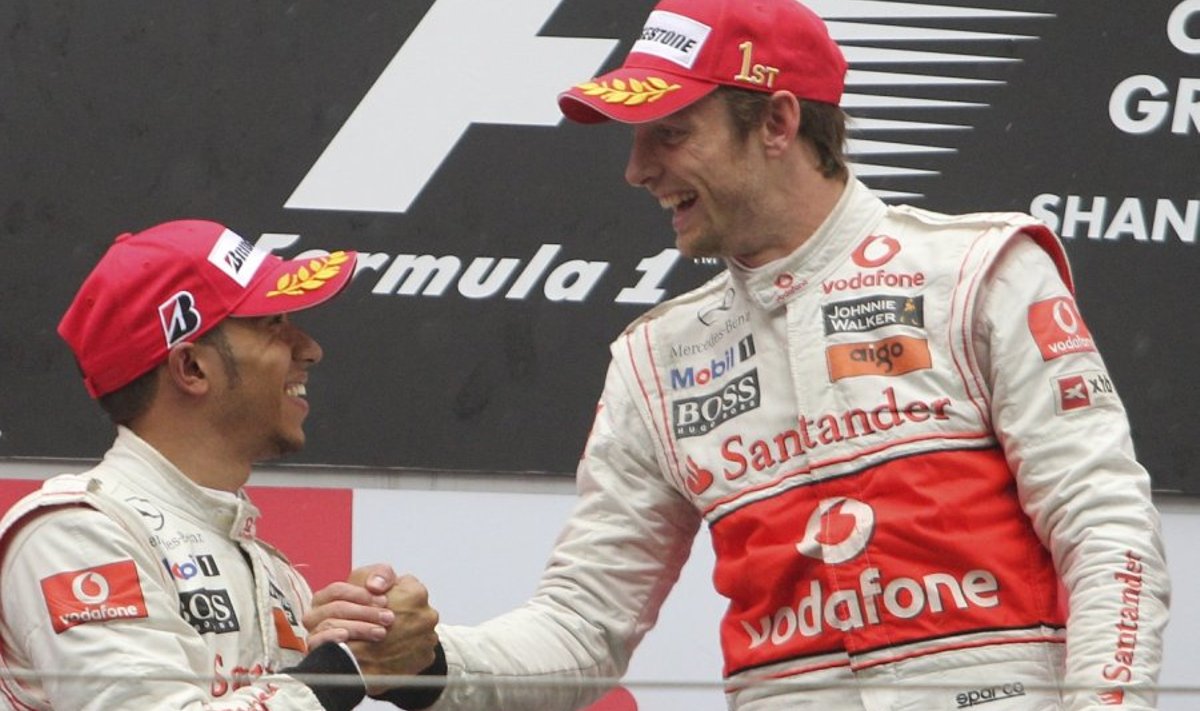 McLaren Formula One driver Jenson Button, right, of Britain is congratulated by teammate and compatriot Lewis Hamilton after he won the Chinese Formula One Grand Prix at the Shanghai International Circuit in Shanghai, China, Sunday, April 18, 2010. Hamilton finished second.(AP Photo/Eugene Hoshiko) / SCANPIX Code: 436