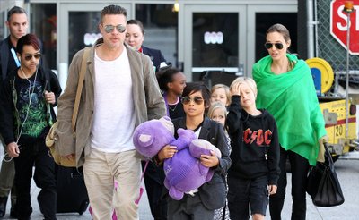 Brad Pitt, Angelina Jolie and family arriving at the Los Angeles International Airport