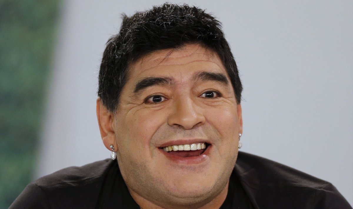 Argentina's soccer legend Diego Maradona smiles as he hosts his television show 'De Zurda' in Caracas