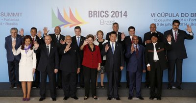 Leaders pose for the official photo session for the 6th BRICS summit and the Union of South American Nations (UNASUR) in Brasilia