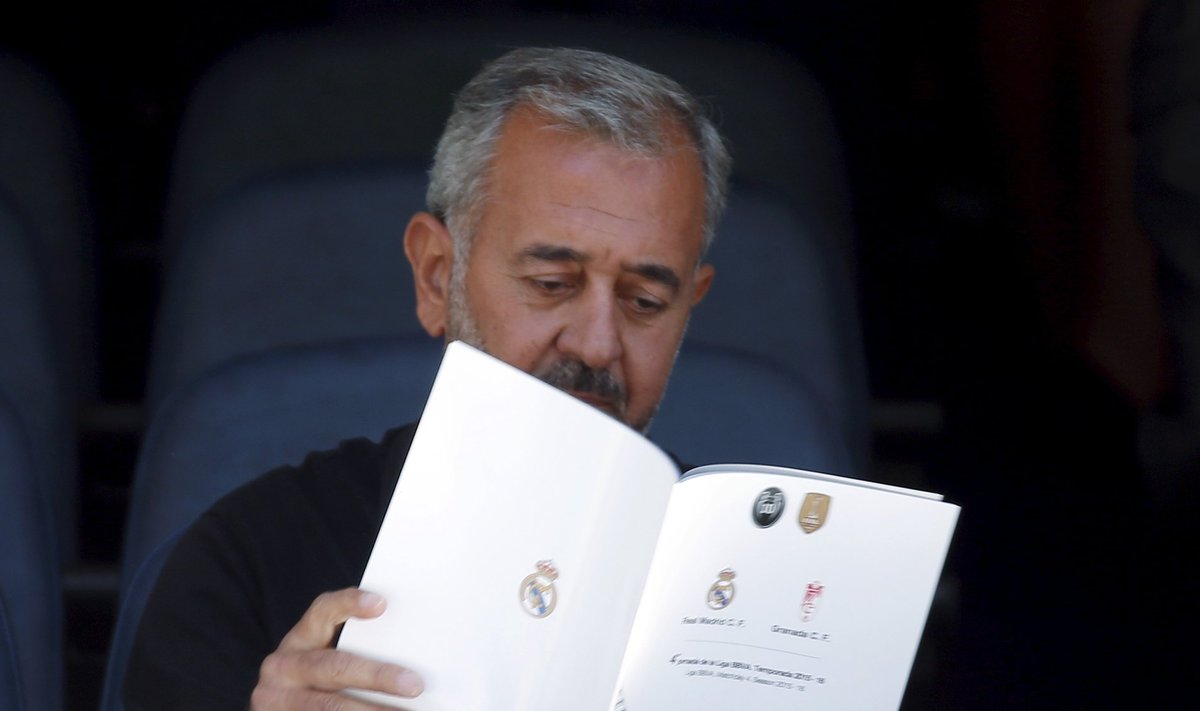 Osama Abdul Mohsen, a Syrian refugee who was filmed being tripped by a camerawoman as he fled police in Hungary with his young son, reads papaers before the Spanish first division soccer match between Real Madrid and Granada in Madrid
