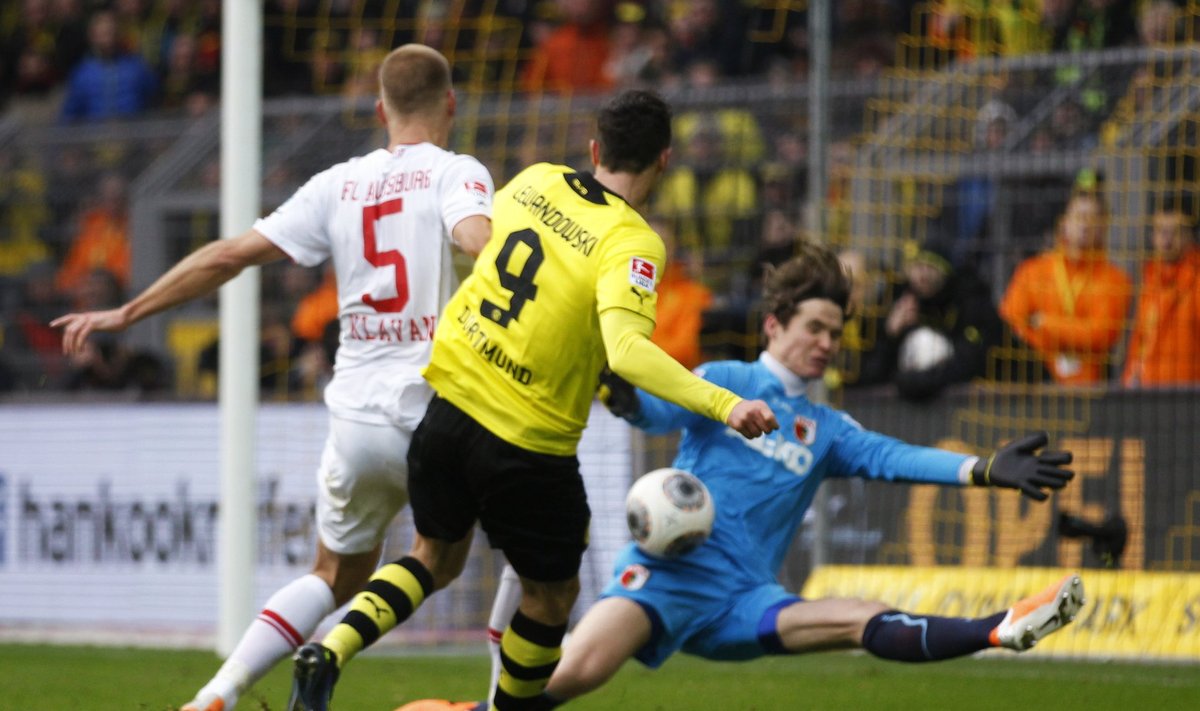Borussia Dortmund's Lewandowski tries to score against Augsburg during the German first division Bundesliga soccer match in Dortmund