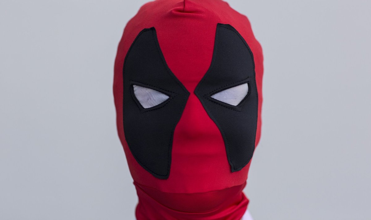 Xavier Lopez attends New York Comic Con dressed as Deadpool from Marvel's comics in Manhattan