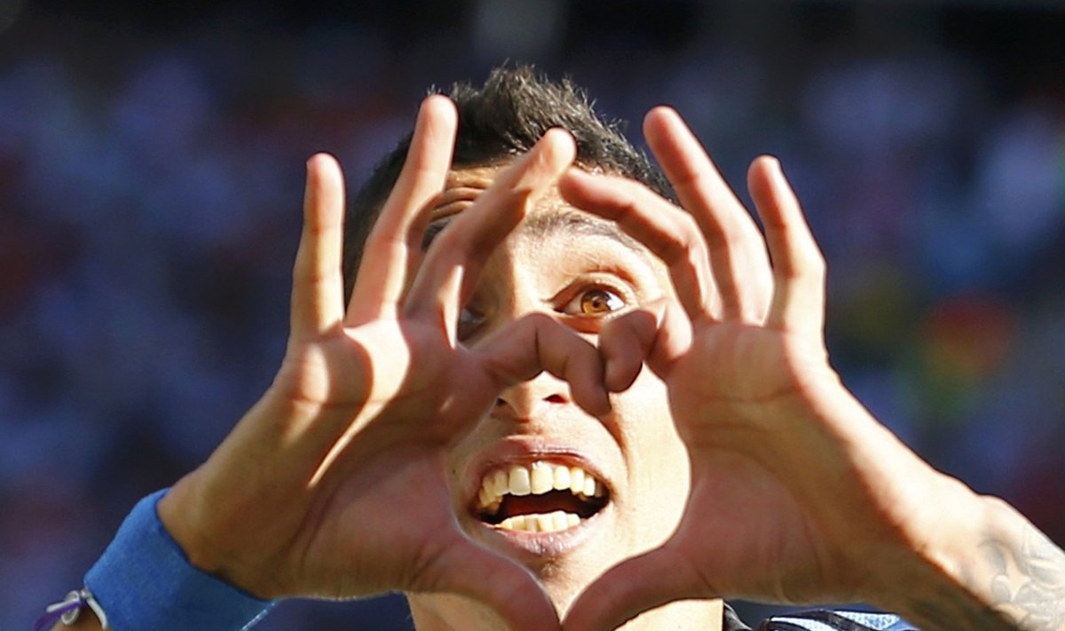 File photo of Argentina's Di Maria celebrating his scoring against Switzerland during extra time in their 2014 World Cup round of 16 game in Sao Paulo