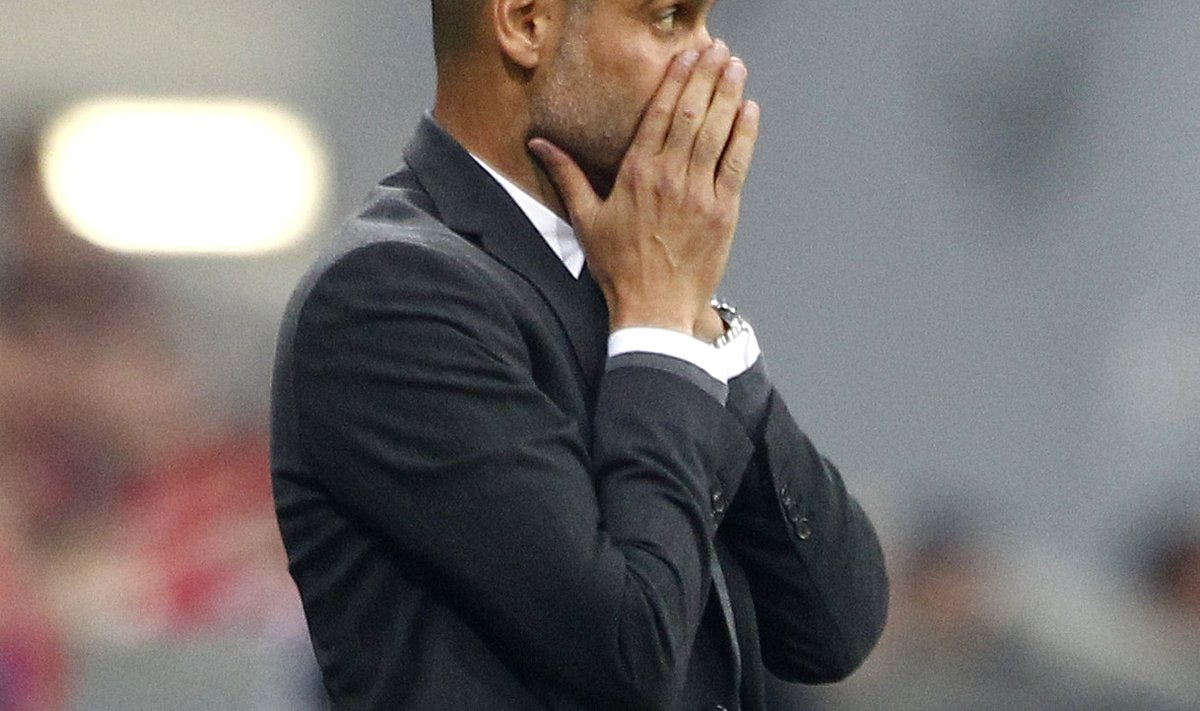 Bayern Munich's coach Guardiola watches players during Champions League soccer match against Manchester City in Munich