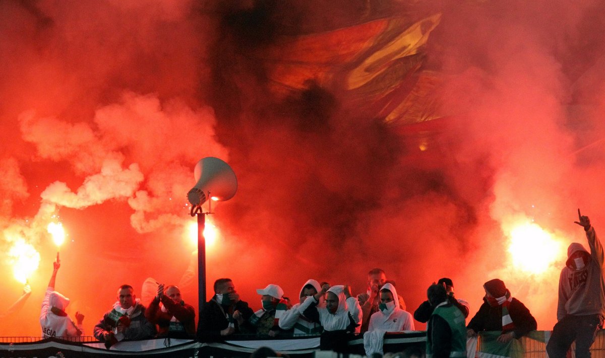 File photo of hooligans lighting flares at the stadium after the Polish Cup final soccer match between Legia Warsaw and Lech Poznan in Bydgoszcz