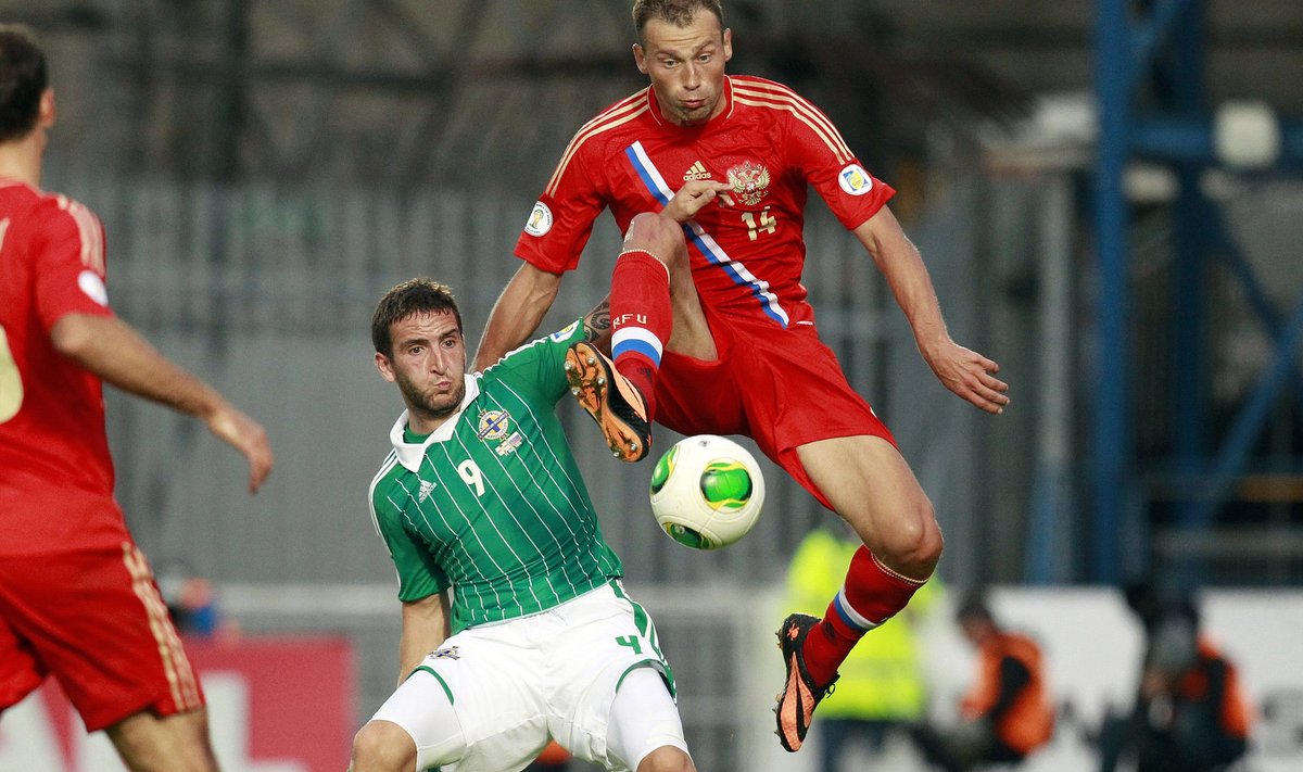 Northern Ireland's Martin Paterson is challenged by Russia's Vasily Berezutskyi during their World Cup qualifying soccer match at Windsor Park Stadium in Belfast