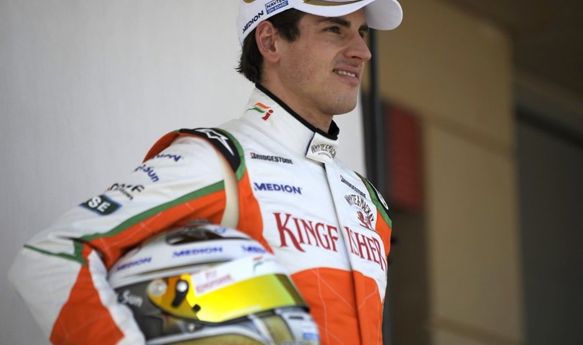 Force India's German driver Adrian Sutil poses in the paddock of the Bahrain international circuit on March 11, 2010 in Manama, three days ahead of the Bahrain Formula One Grand Prix.          AFP PHOTO / FRED DUFOUR