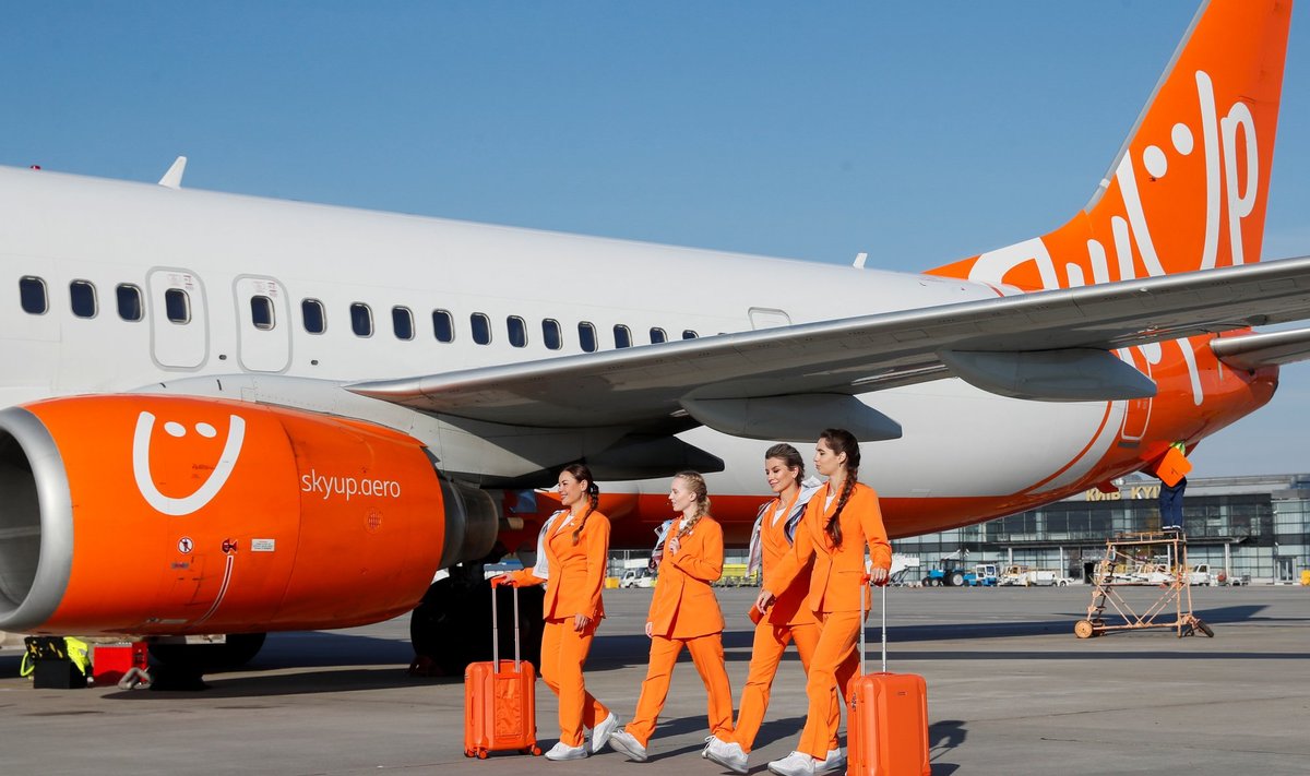 SkyUp Airlines flight attendants present a new uniform at an airport outside Kyiv