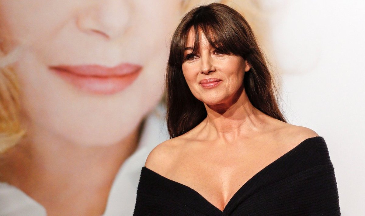 Italian actress Monica Bellucci poses for photographs at the opening day of the Lumiere Festival in Lyon