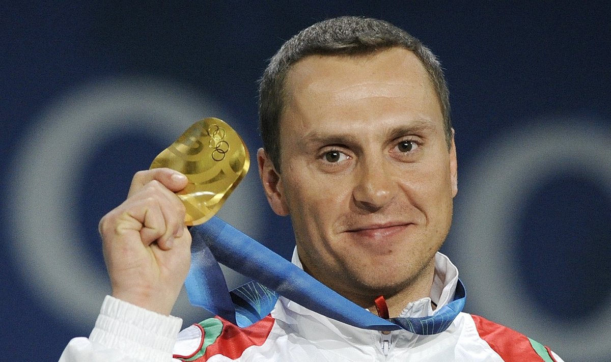 Belarus’ Alexei Grishin takes gold in freestyle skiing aerials at 2010 Olympics