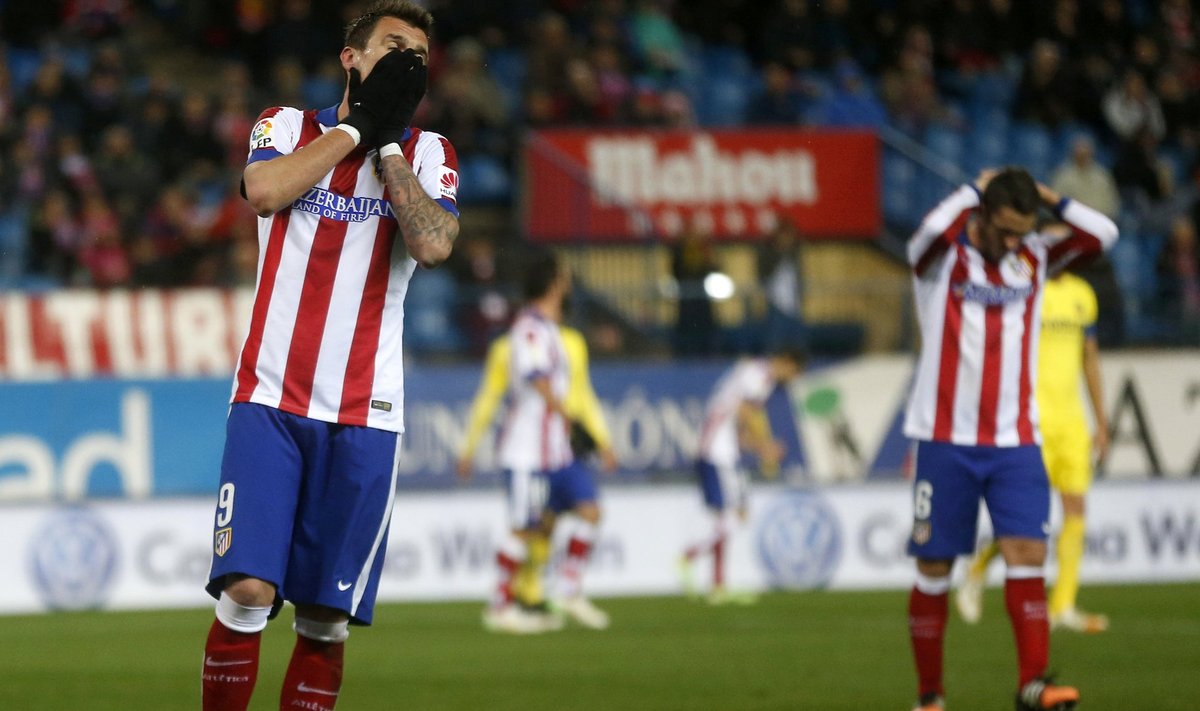 Atletico Madrid's Mario Mandzukic and Koke react during their Spanish first division soccer match against Villareal at Vicente Calderon stadium in Madrid
