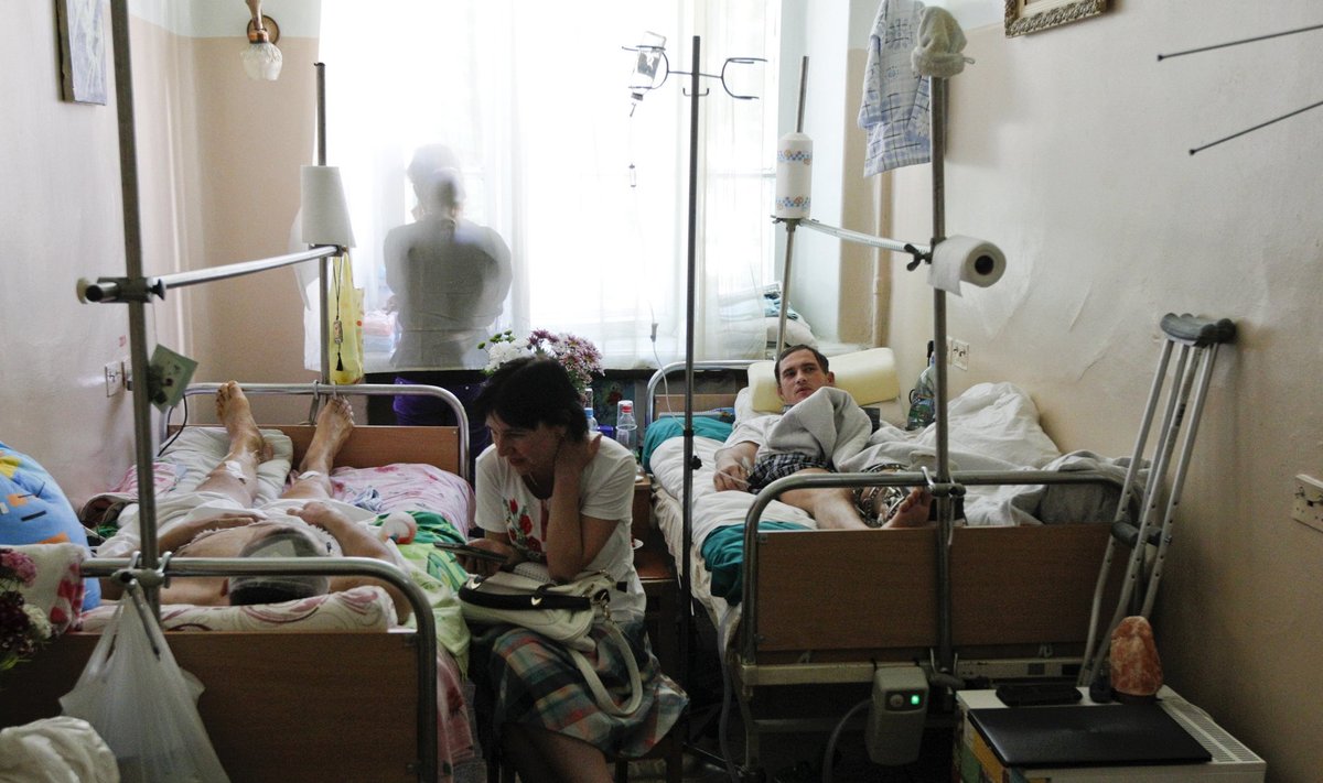 Soldiers of the Ukrainian Army who have been injured during fighting against separatists in Eastern Ukraine, lie on hospital beds in a ward at the Central Clinical Hospital of the Ministry of Defense of Ukraine in Kiev