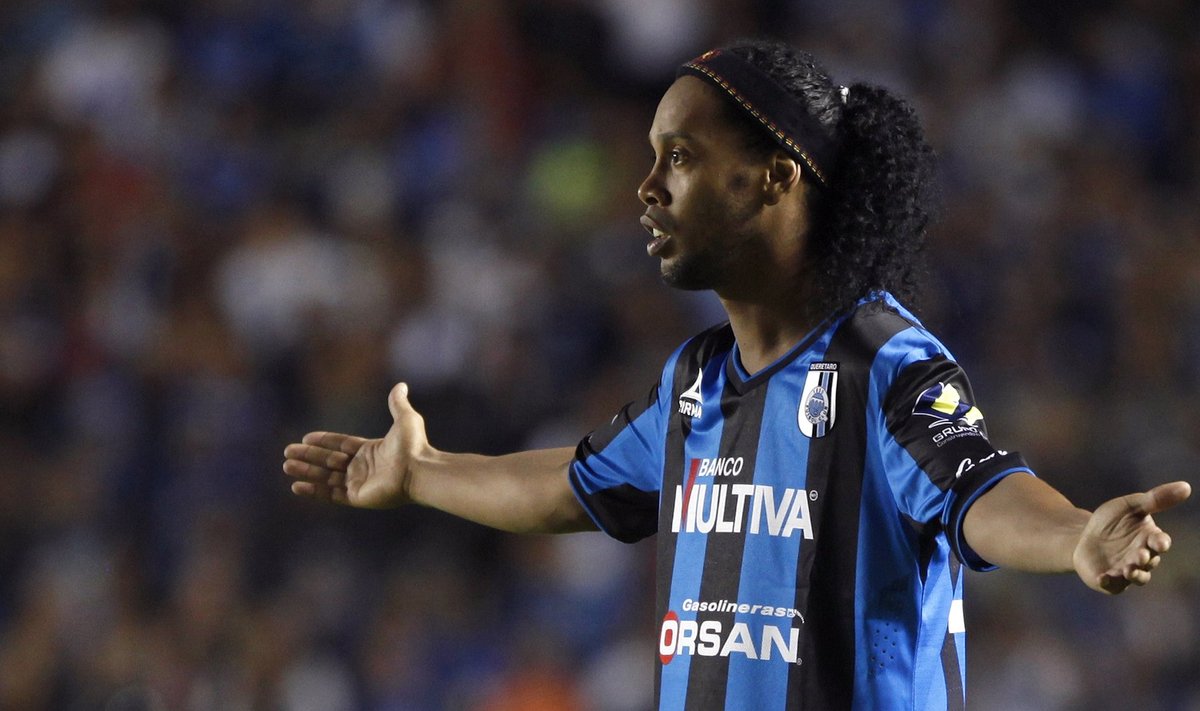Queretaro's Ronaldinho gestures during a Copa MX soccer match against Tigres in Queretaro