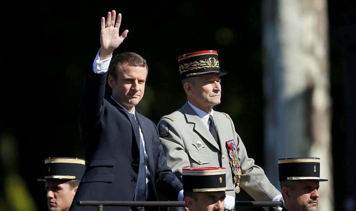 FILE PHOTO: French President Emmanuel Macron and Chief of the Defence Staff French Army General Pierre de Villiers arrive in a command car for the traditional Bastille Day military parade on the Champs-Elysees in Paris