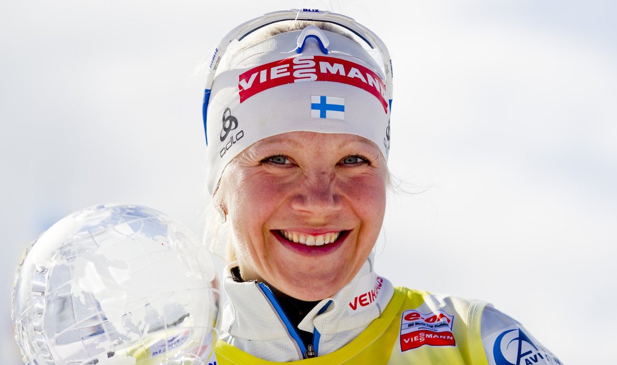 Makarainen holds trophy after the women's 12.5km biathlon mass start in Holmenkollen Ski Arena