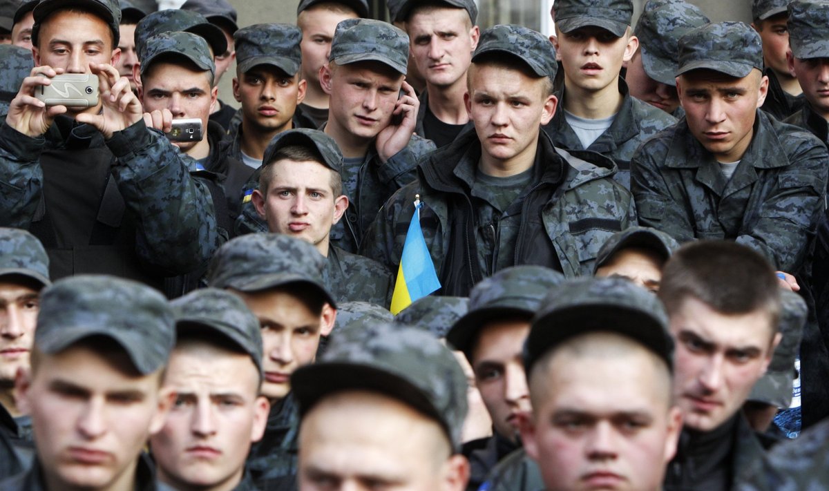 Conscripts of the National Guard of Ukraine gather near the presidential administration headquarters to demand their demobilization in Kiev