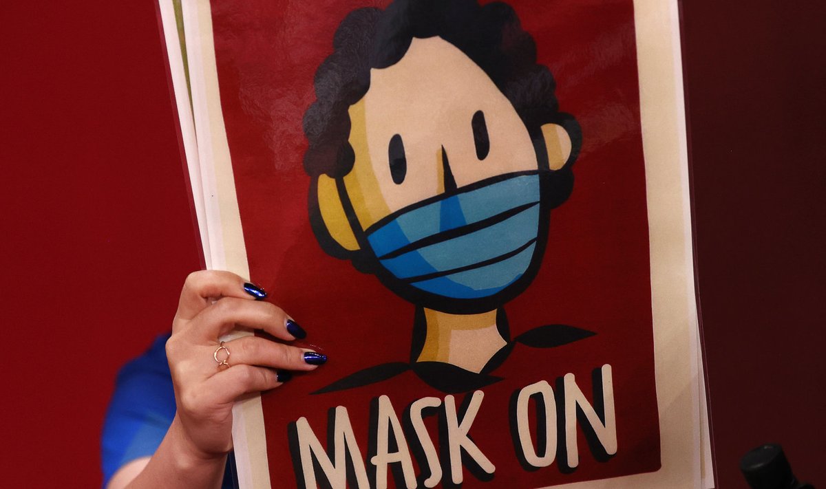 Plakat Tokyo olümpial, mille sõnum on lihtne: "Mask ette"