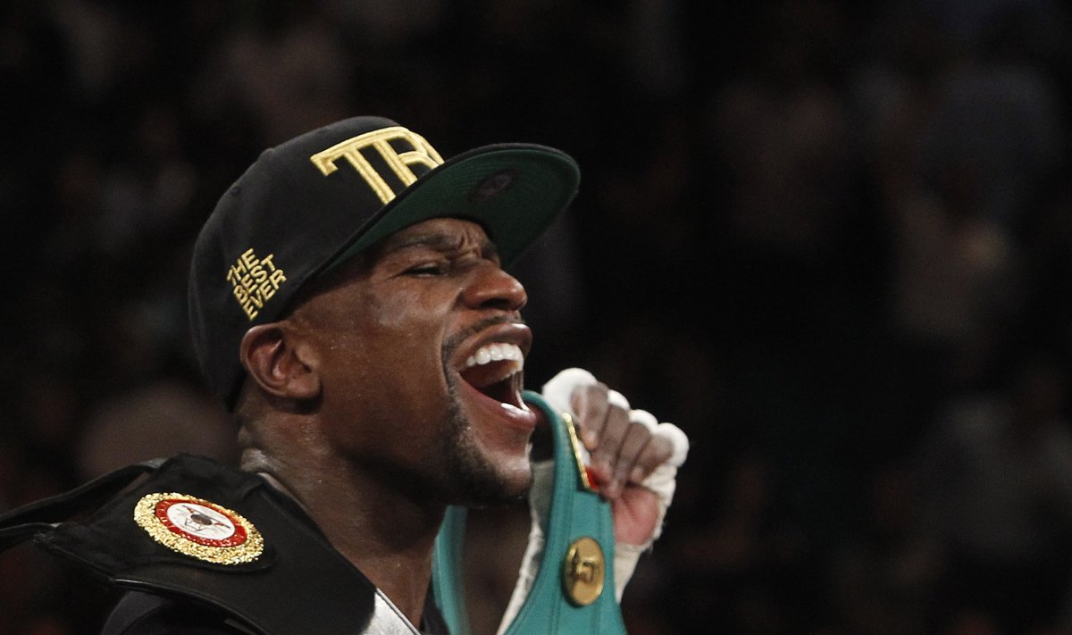 Mayweather Jr. of the U.S. celebrates his victory over Alvarez at the MGM Grand Garden Arena in Las Vegas