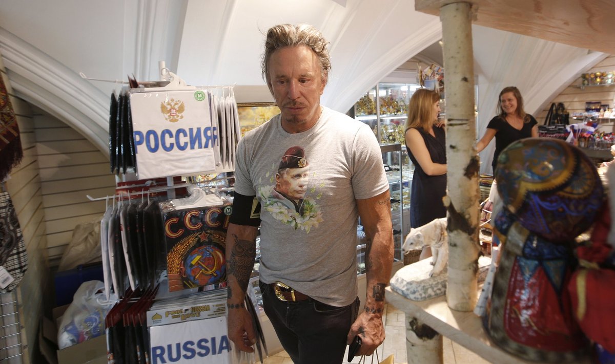Actor Rourke wears a T-shirt with an image depicting Russia's President Vladimir Putin, as he visits a souvenir shop at GUM department store in central Moscow