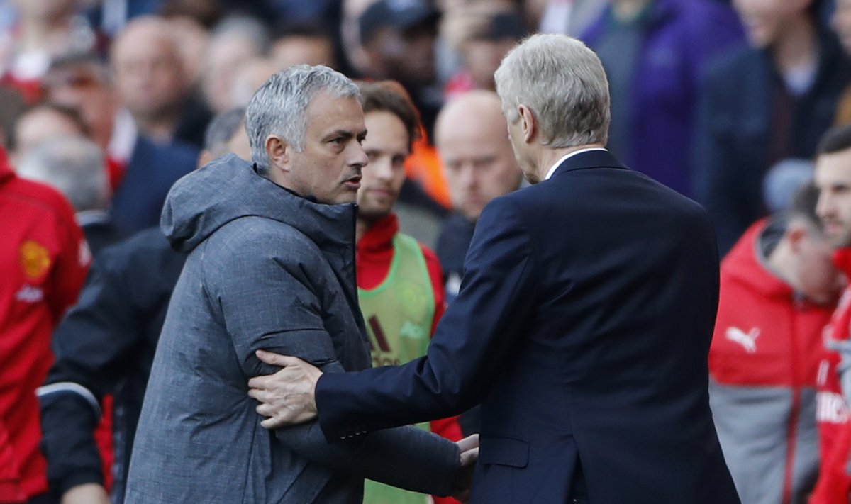 Arsenal manager Arsene Wenger shakes hands with Manchester United manager Jose Mourinho after the game