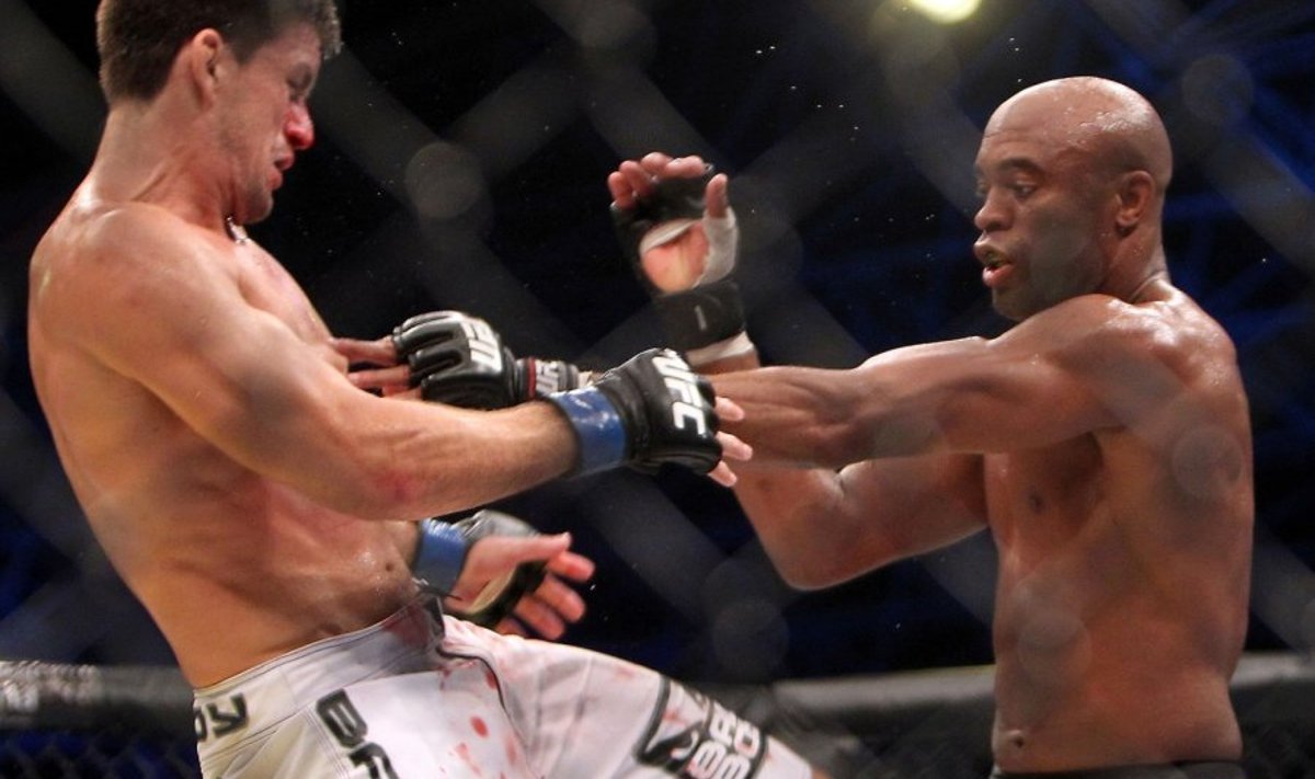 Brazil's Anderson Silva (R) battles his compatriot Demian Maia during their Ultimate Fighting Championship (UFC) 112 middleweight bout in Abu Dhabi on April 10, 2010. Silva won the fight. AFP PHOTO/KARIM SAHIB