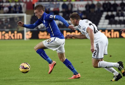Swansea City's Angel Rangel chases Leicester City's Jamie Vardy during their English Premier League soccer match in Swansea