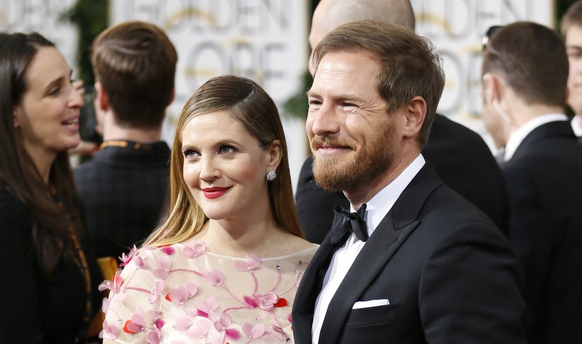 Actress Drew Barrymore and husband, Will Kopelman, arrive at the 71st annual Golden Globe Awards in Beverly Hills