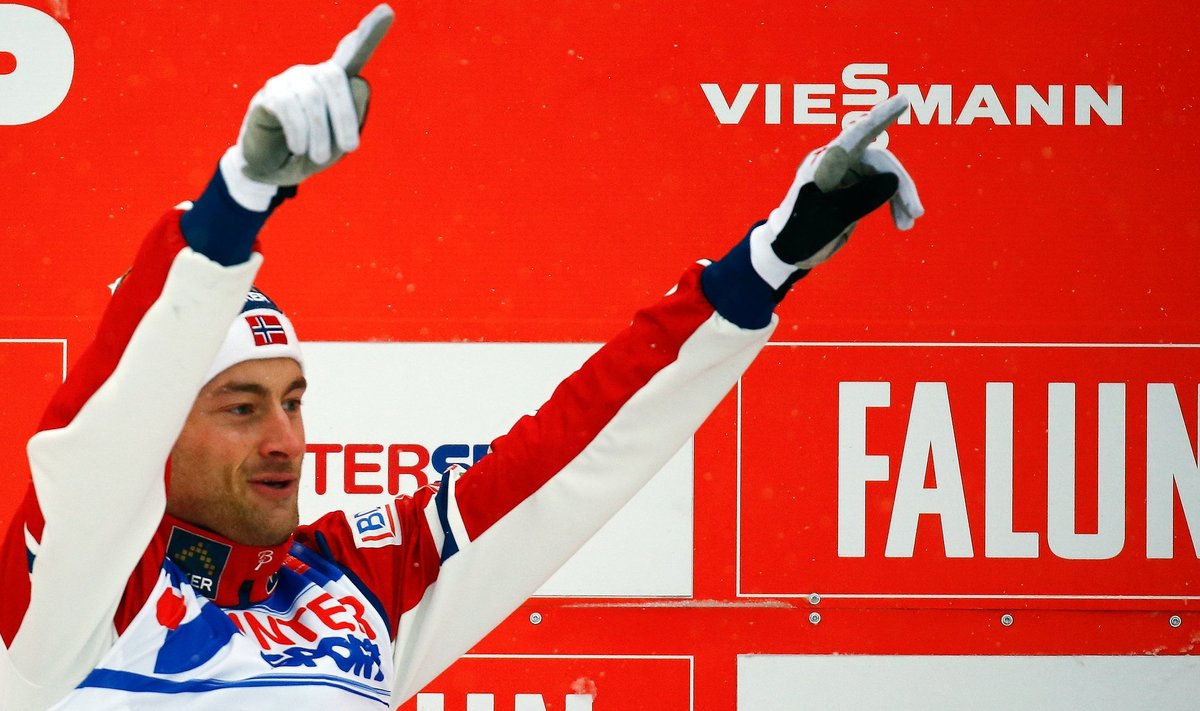 Norway's Northug celebrates winning the men's cross country 50 km mass start classic race at the Nordic World Ski Championships in Falun