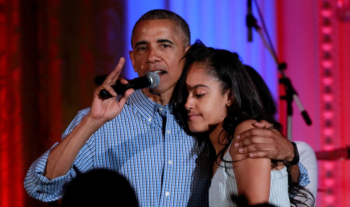 U.S. President Barack Obama congratulates his daughter Malia on her birthday during the Independence Day celebration at the White House in Washington