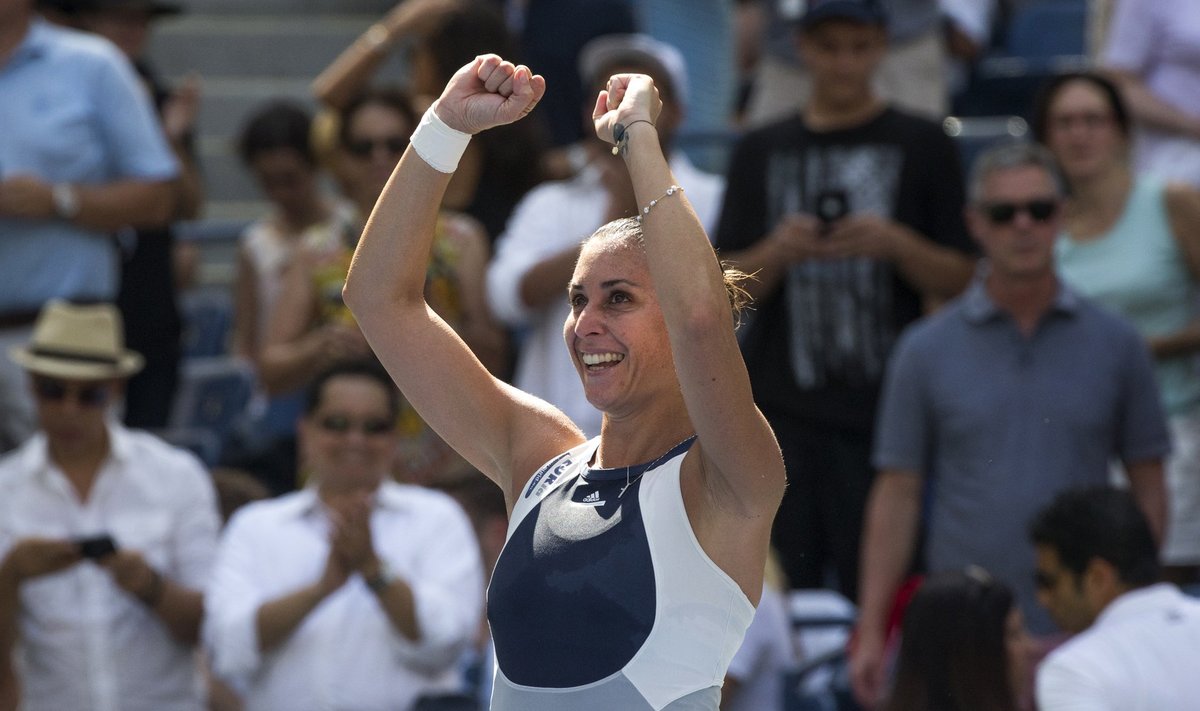 Pennetta of Italy celebrates after defeating Kvitova of the Czech Republic in their quarterfinals match at the U.S. Open Championships tennis tournament in New York