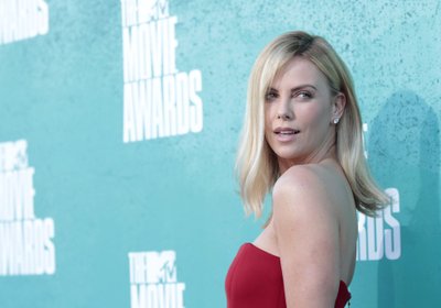 Actress Charlize Theron arrives at the 2012 MTV Movie Awards in Los Angeles