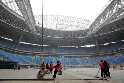 Labourers work at new stadium under construction on Krestovsky Island that will host 2017 Confederations Cup and 2018 World Cup matches in St. Petersburg