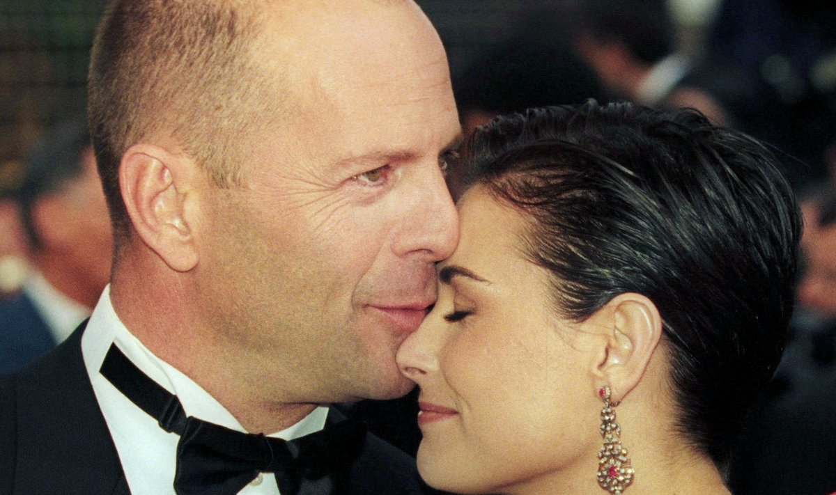 Bruce Willis and Demi Moore arrive for the screening of "le Cinquieme Element" at the opening of the 50th Cannes Film Festival