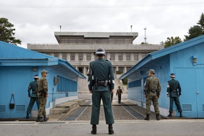 South Korean soldiers look towards the North Korean side on the border of the DMZ, in Panmunjom
