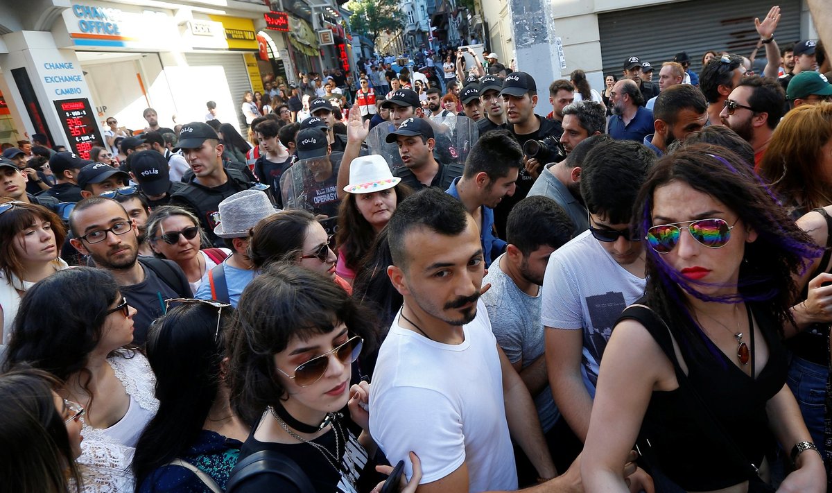 Riot police disperse LGBT rights activists as they try to gather for a pride parade in central Istanbul