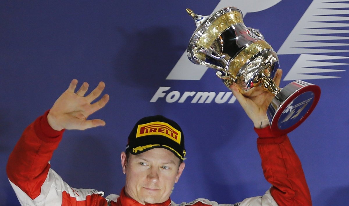 Ferrari driver Raikkonen of Finland celebrates his second place on the podium after Bahrain's F1 Grand Prix