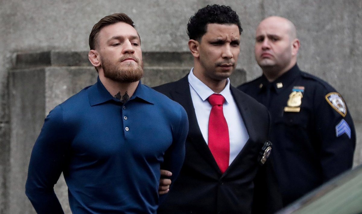 MMA fighter McGregor walks out of the 78th police precinct after charges were laid against him in the Brooklyn borough of New York City