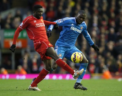 Sunderland's Jozi Altidore challenges Liverpool's Kolo Toure during their English Premier League soccer match at Anfield in Liverpool