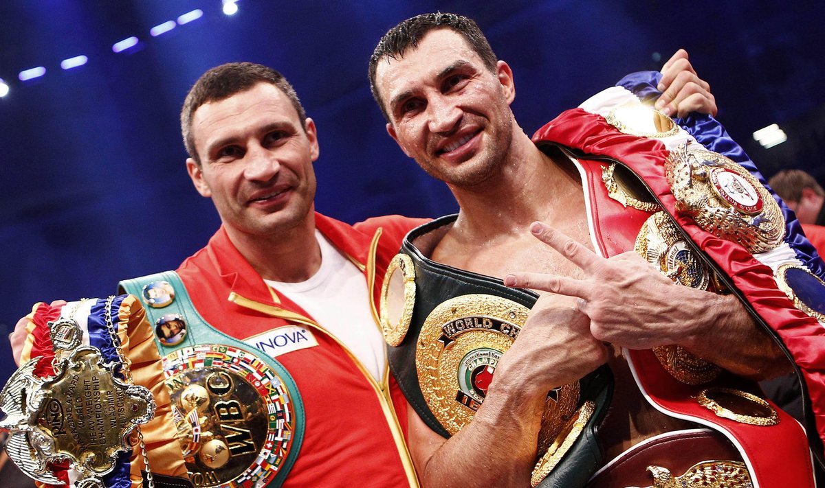 Klitschko of Ukraine celebrates with his brother after defeating Haye of Britain in a heavyweight title unification boxing match in Hamburg