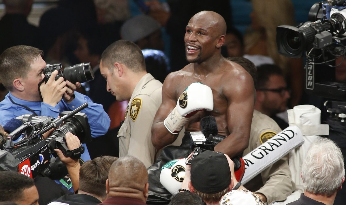 Floyd Mayweather Jr. of the U.S. celebrates his victory over Marcos Maidana of Argentina in their WBC/WBA welterweight unification fight at the MGM Grand Garden Arena in Las Vegas
