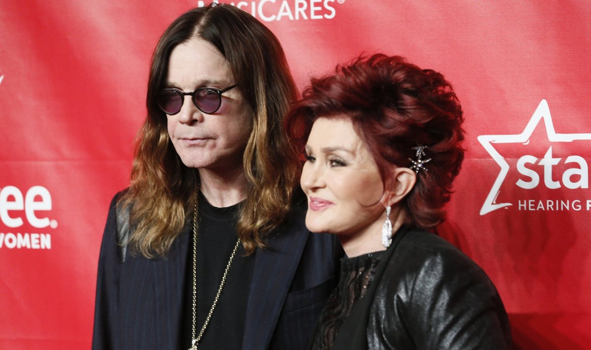 Ozzy Osbourne and Sharon Osbourne pose at the 2014 MusiCares Person of the Year gala honoring Carole King in Los Angeles