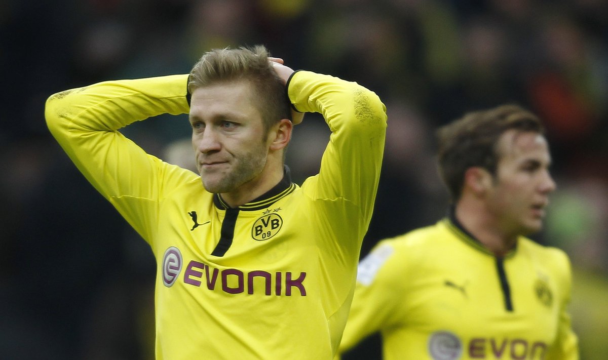 Borussia Dortmund's Blaszczykowski and Goetze react during the German first division Bundesliga soccer match against Hamburger SV in Dortmund