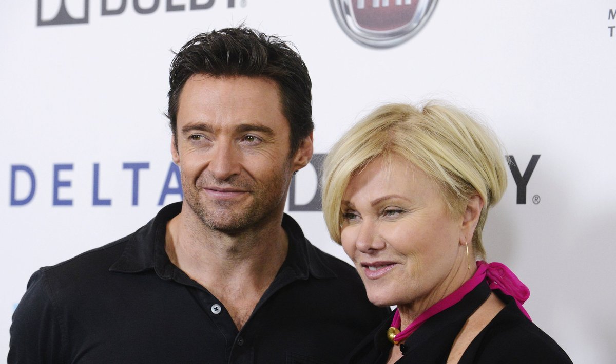Hugh Jackman and wife pose for photographs following Jackman's performance of "One Night Only" benefiting the Motion Picture and Television Fund in Los Angeles