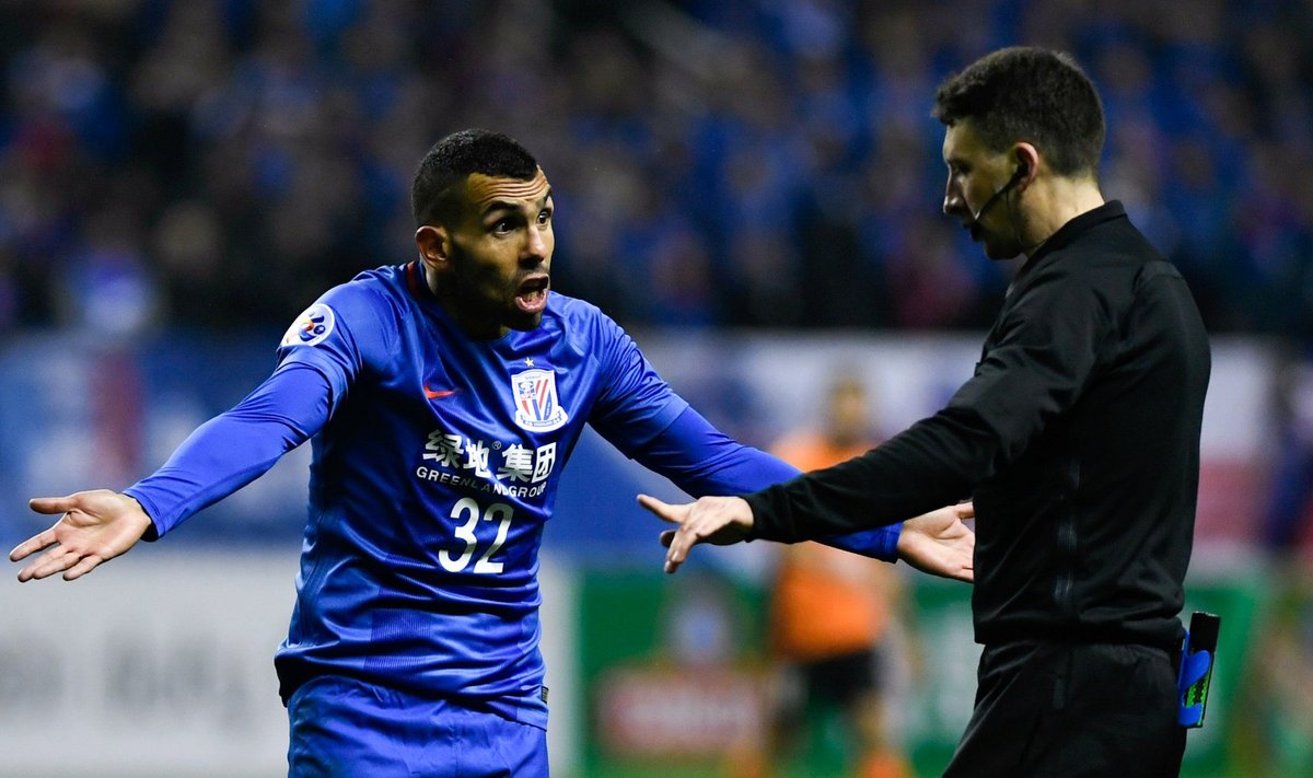 Shanghai Shenhua's Carlos Tevez reacts to a referee during the AFC Champions League 2017 play-off match between Shanghai Shenhua and Brisbane Roar in Shanghai