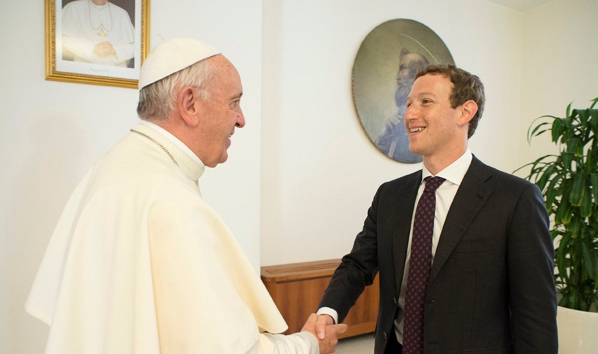 Pope Francis shakes hands with Facebook CEO Zuckerberg during a meeting at the Vatican