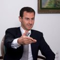 Läti eurosaadik Mamikins kinkis Assadile Riia kujutisega hõbemündi